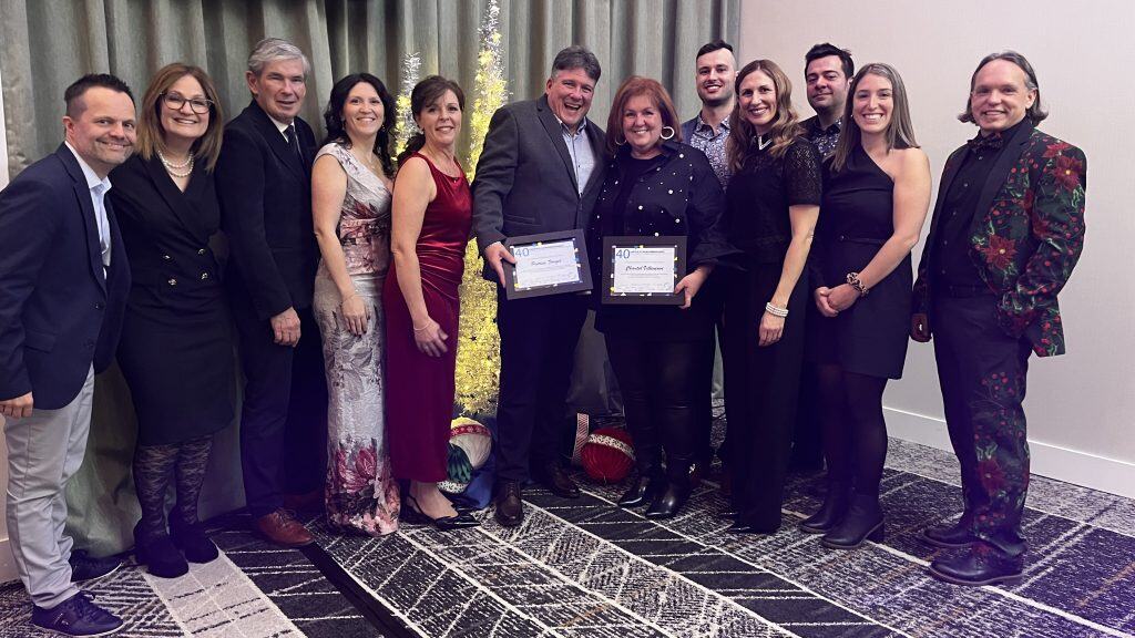 Group of professionals at an awards ceremony at Amyot Gelinas, highlighting success and expertise in consulting, management and sustainable development.